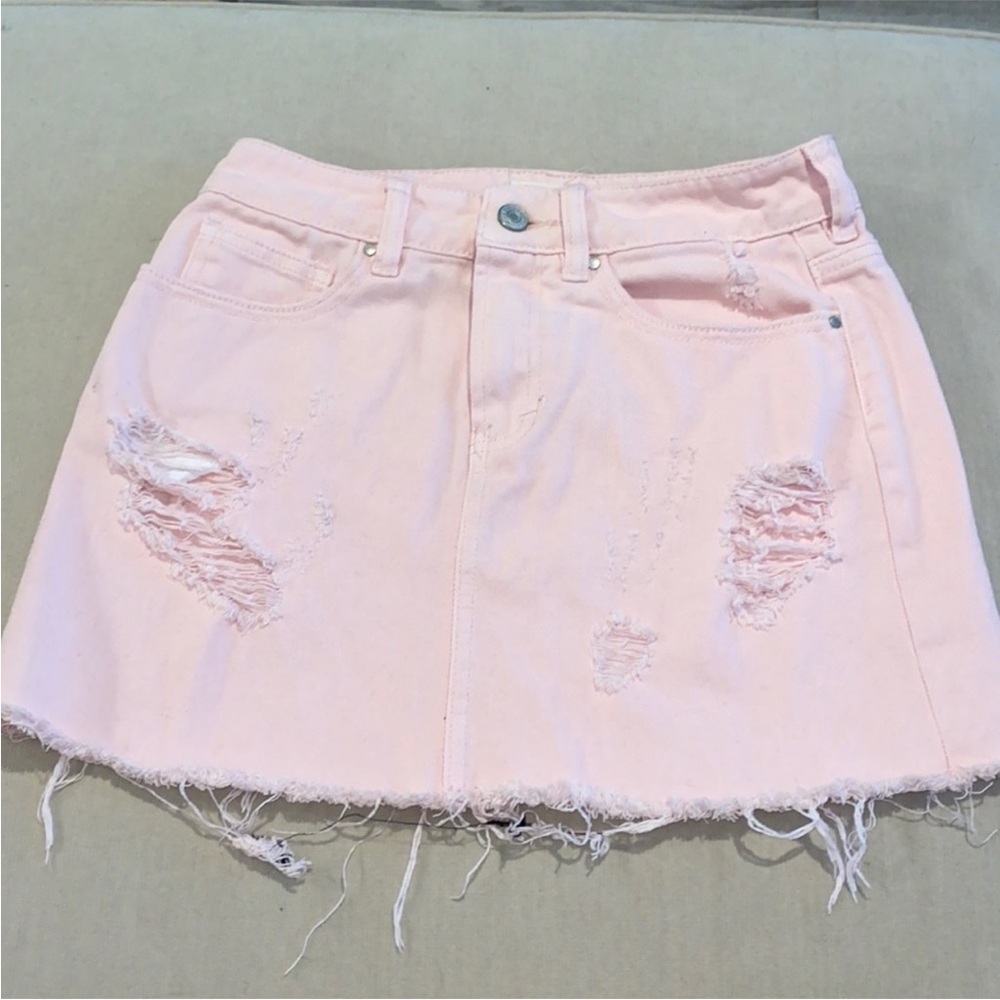 Light pink denim distressed mini skirt